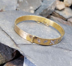 Vintage 9ct Rolled GOLD BANGLE - White Floral Design with Safety Chain - 13.3g